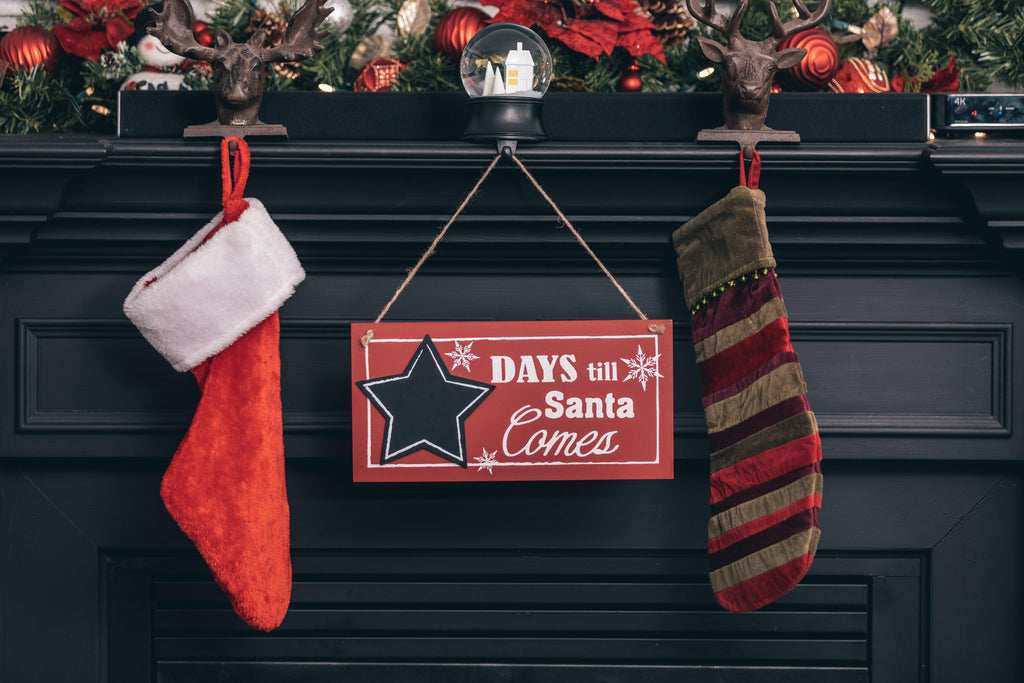 Stockings Hanging from a mantle by Shopify Partners